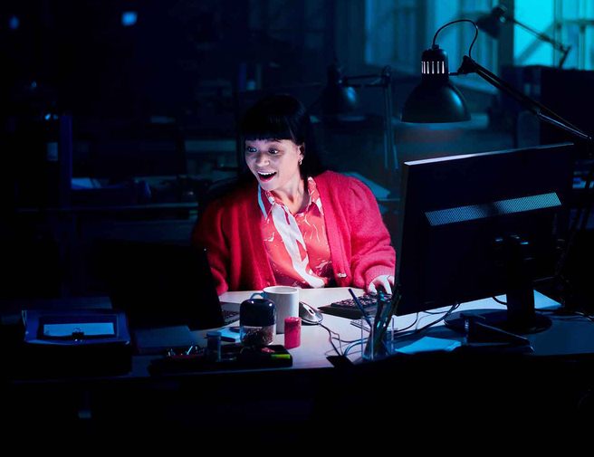 amazed woman working at desk